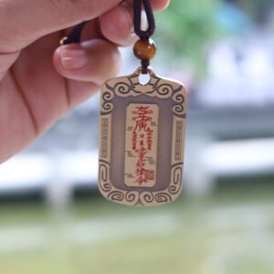 A Taoist amulet featuring Zhao Gongming riding a tiger, symbolizing good fortune and wealth.